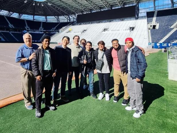 Students on a Soccer stadium field