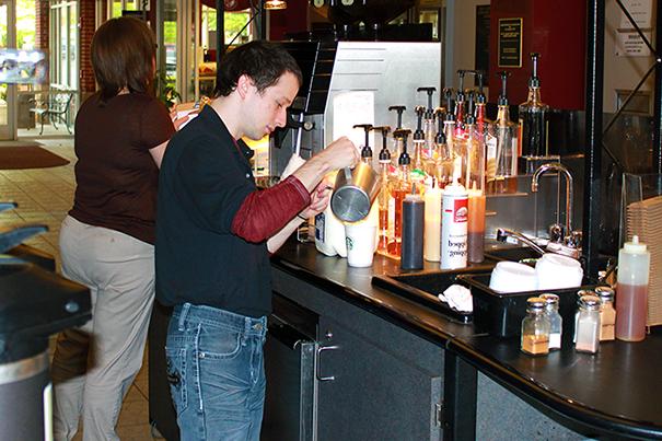 Students serving making Starbucks Coffee